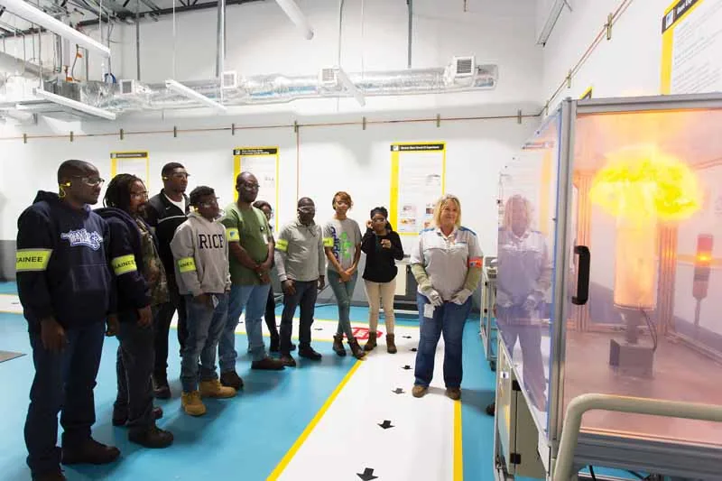 Still's HVAC team members in hands-on technical training with safety gear