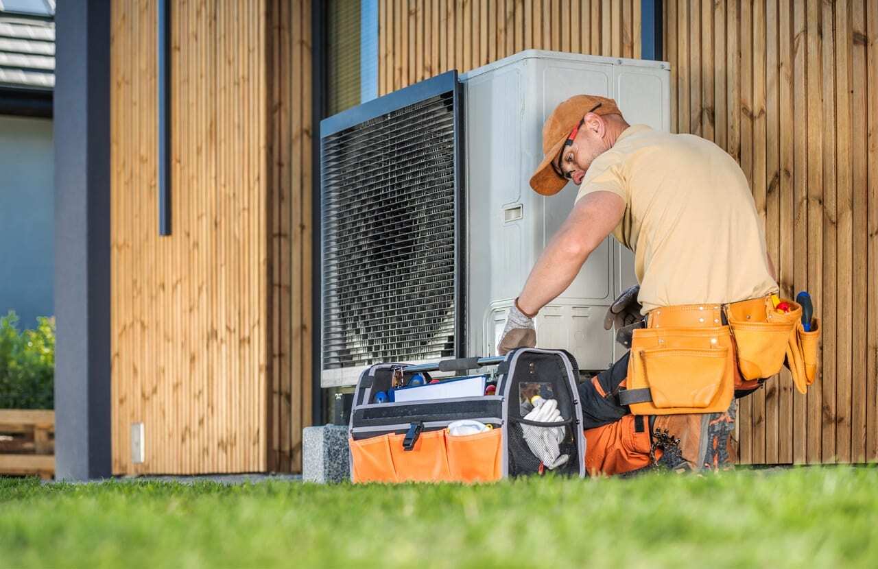 hvac technician worker fixing heat pump at house 2024 05 15 14 08 25 utc